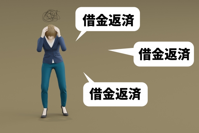 お金を手に頭を抱える。射水市で弁護士や司法書士に債務整理の無料相談をする
