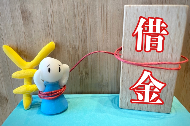 お金を手に頭を抱える。大牟田市で債務整理の無料相談が司法書士に可能